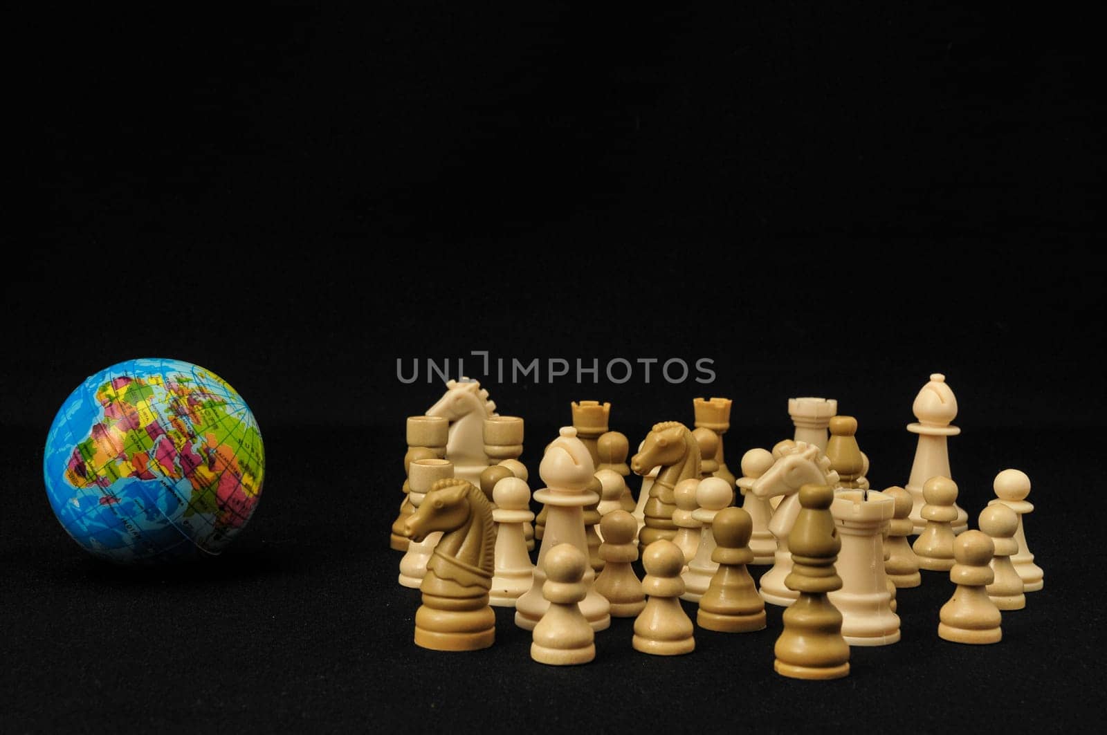 Globe And White Chess on a Black Background