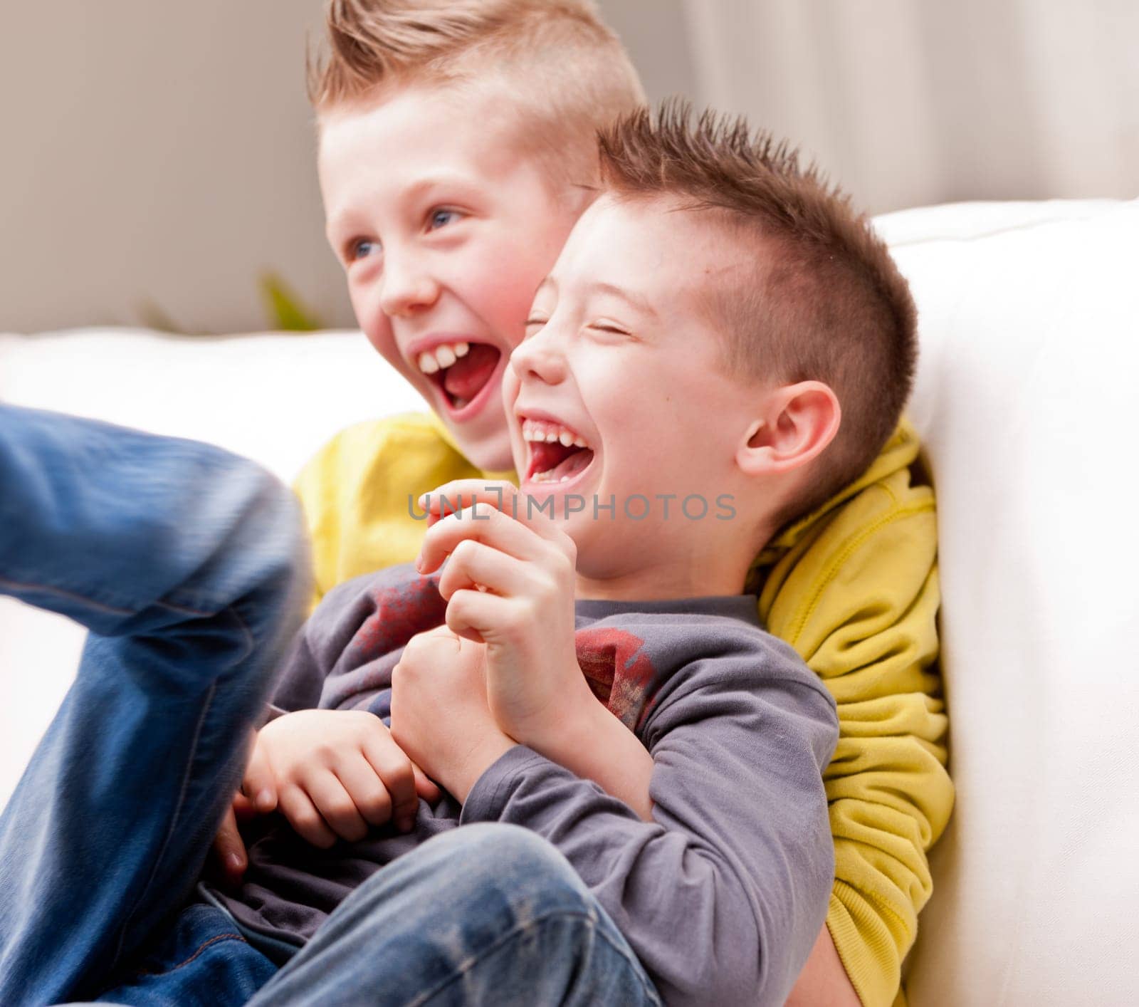 two little boys maybe friends or brothers two little boys laughing about tickling