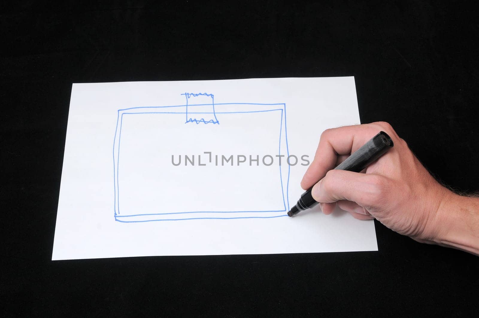 A Caucasian Male Hand Drawing on a White Paper