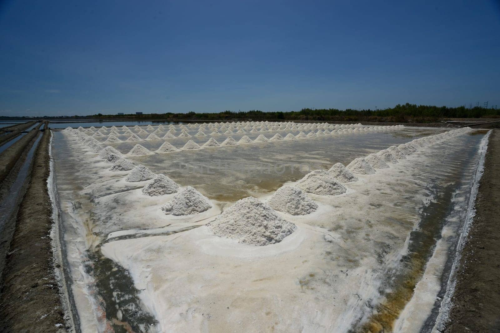 A salt field for the extraction of sea salt south-west of the city of Bangkok in Thailand in South East Asia.