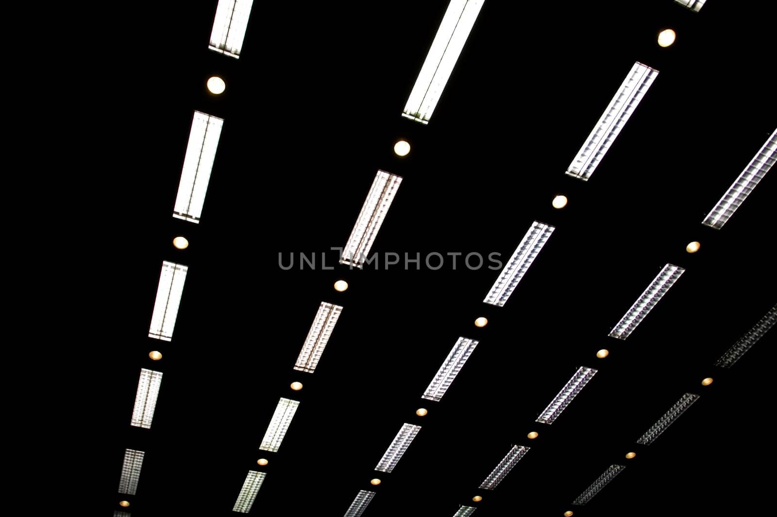 Rows of fluorescent lamps of office ceiling