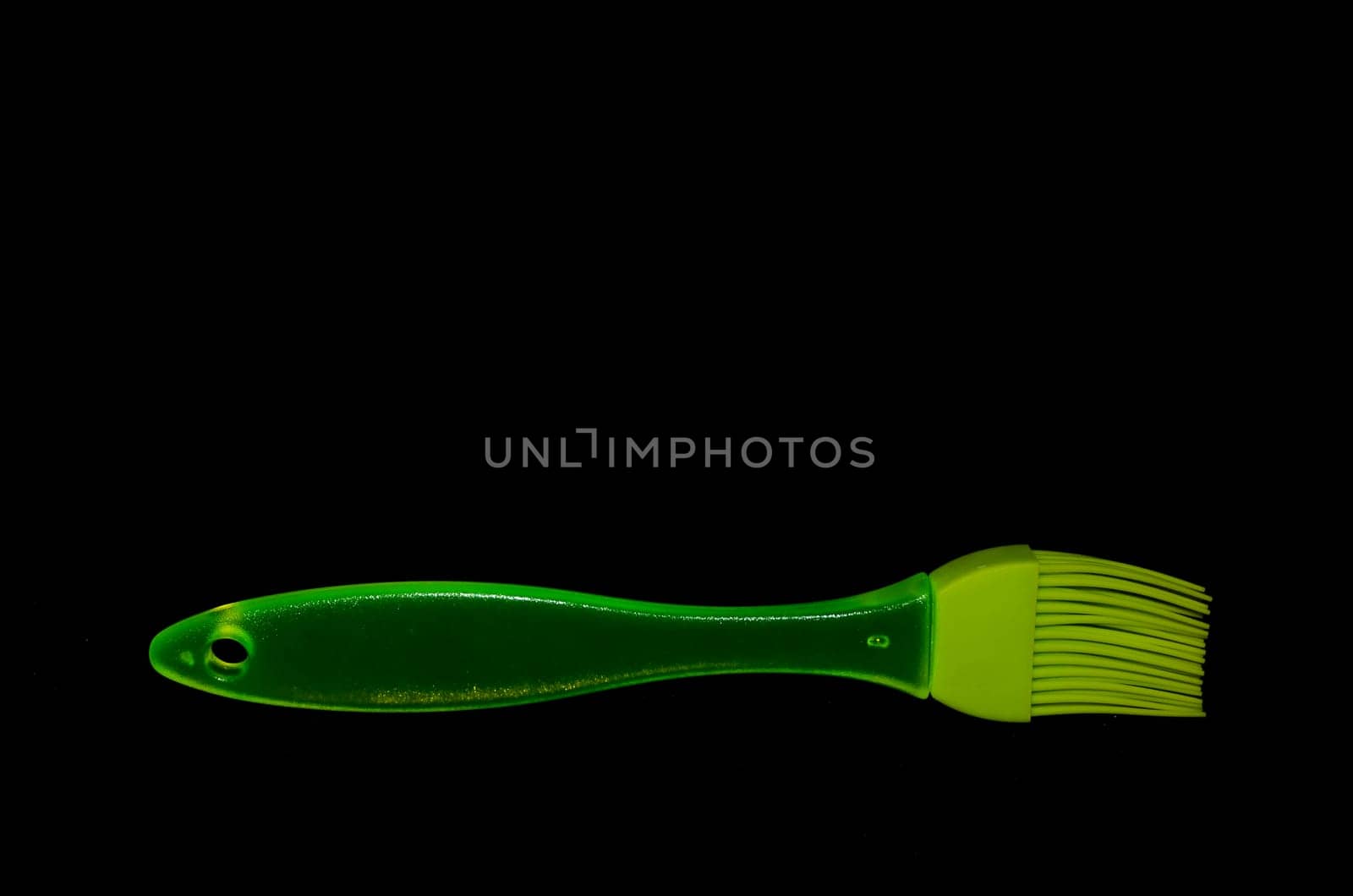 Green Kitchen Silicone Brush on a Black Background