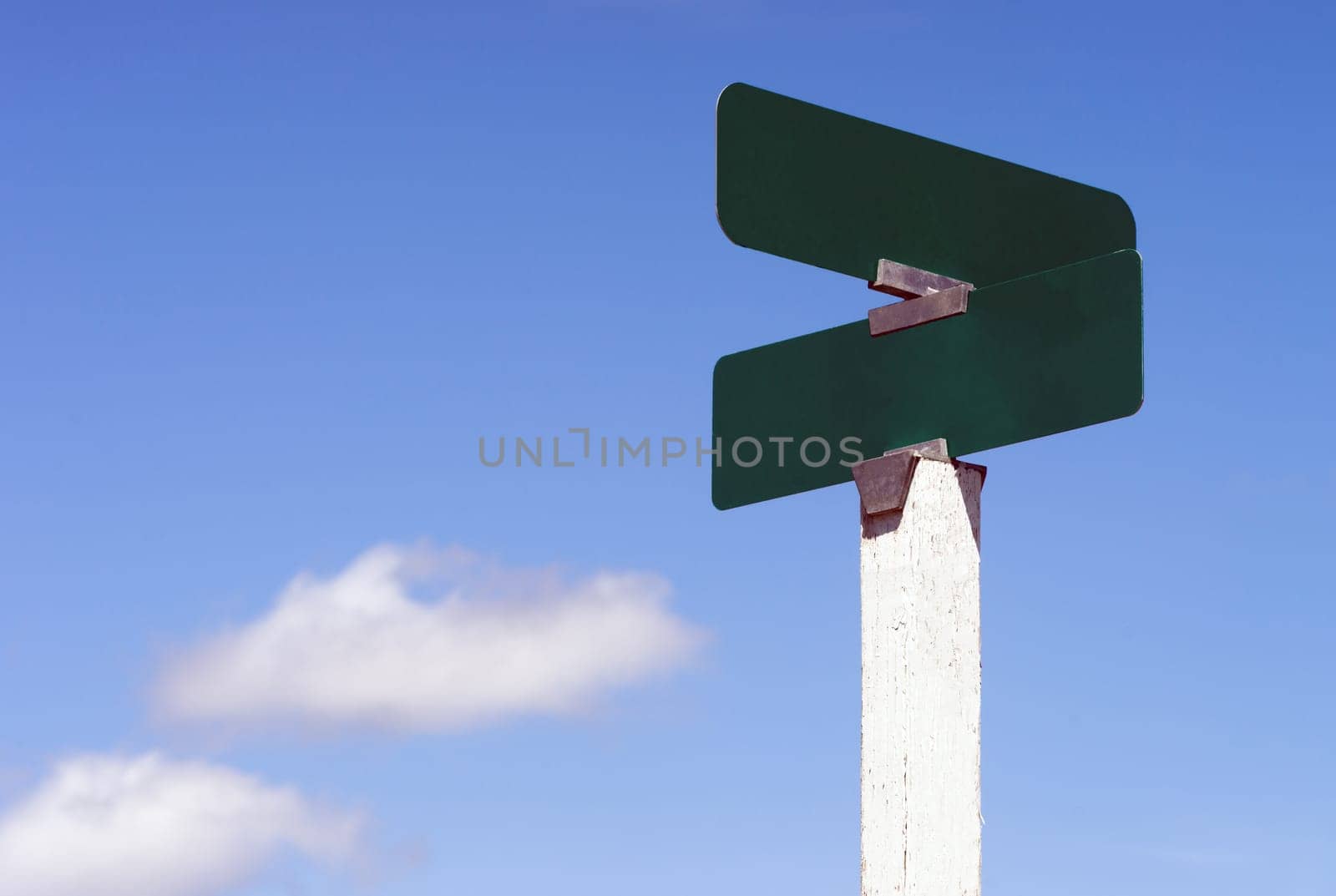 Blank street signs against blue sky ready for your creativity