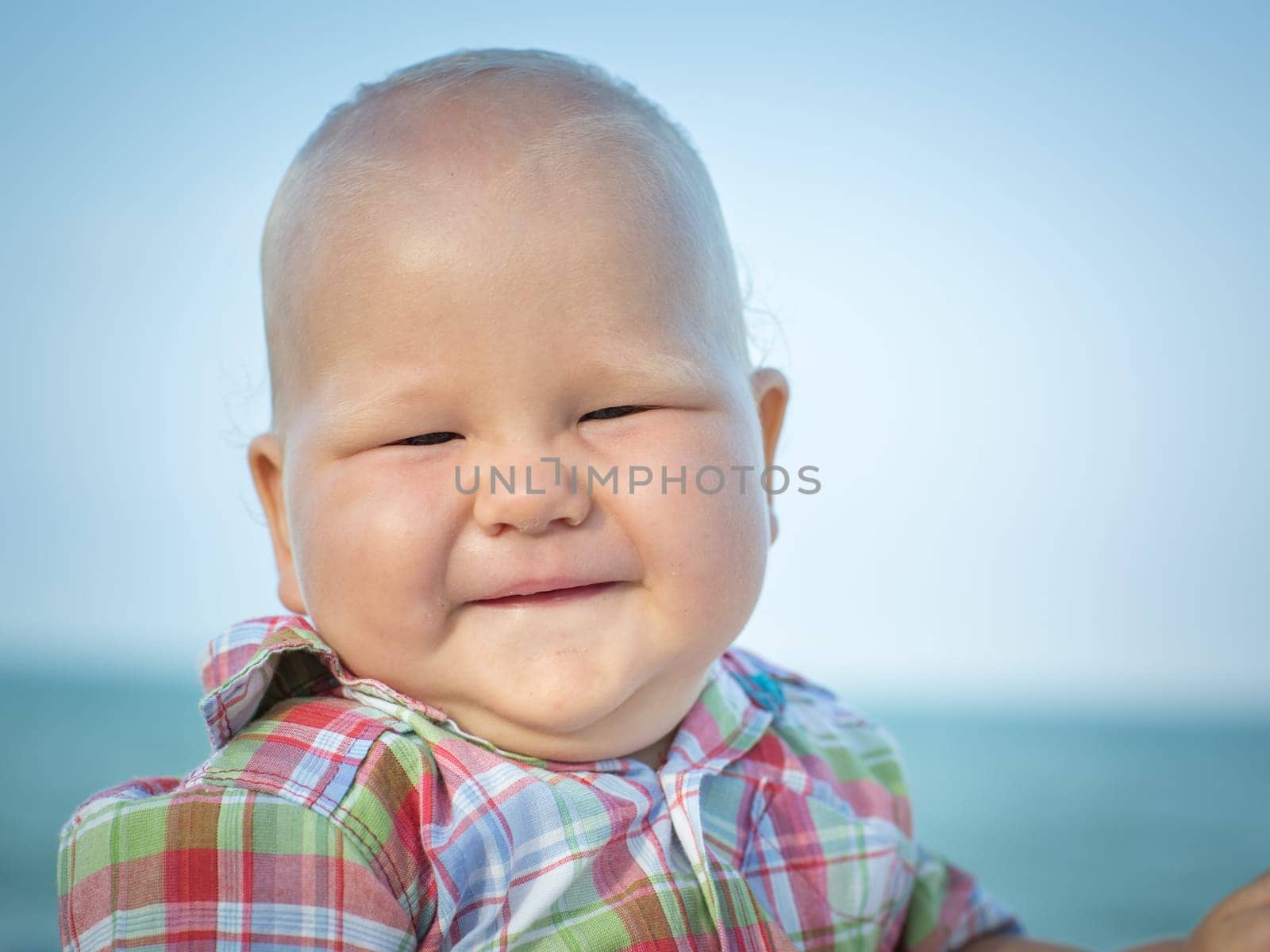 Cute baby on the tropical beach