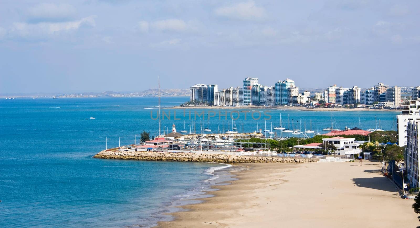 Salinas beach with apartment buildings and yacht club in Ecuador, Pacific Coast