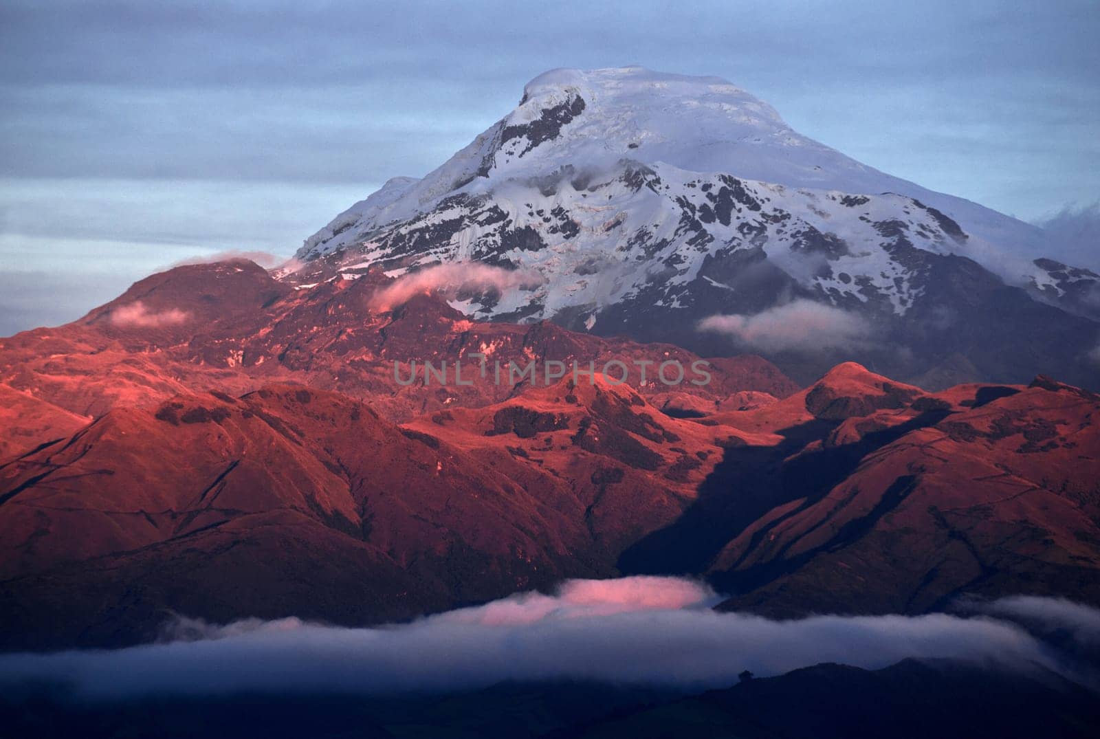 Sunset on the Volcano Cayambe, Cordillera Oriental, a branch of the Ecuadorian Andes. It is located in Pichincha province some 70 km (43 mi) northeast of Quito. It is the third highest mountain in Ecuador, South America