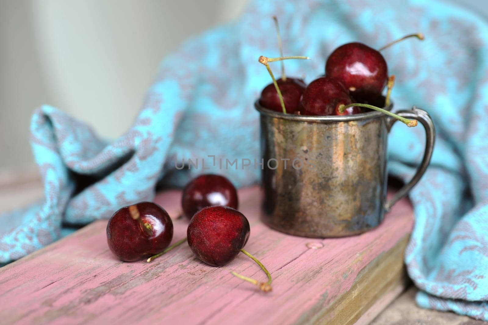 Sweet cherry in the Tin ancient mug