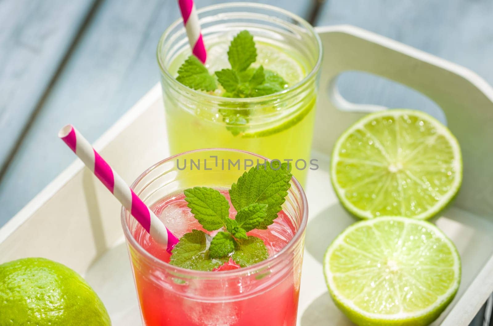Two glasses of ice-cooled lemonade