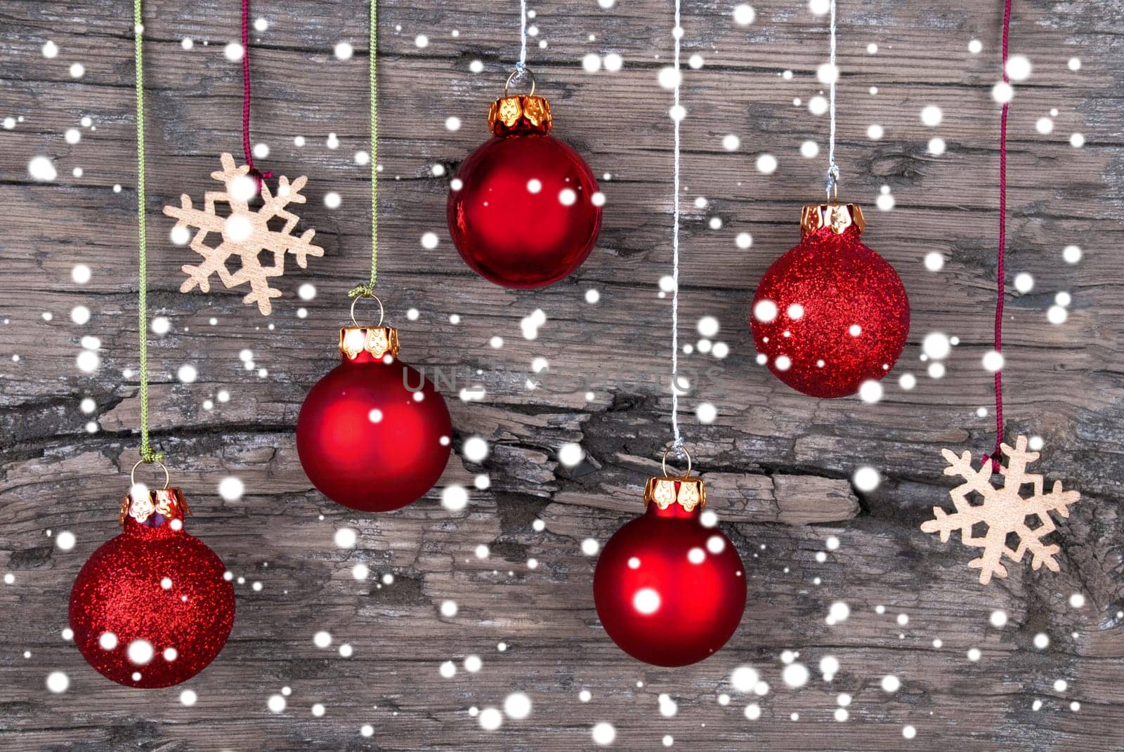 Christmas Balls and Snowflakes on Wood with Snowflakes as Christmas and Winter Background