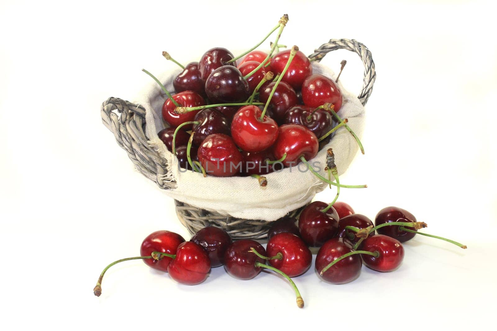 red sweet cherries against a white background