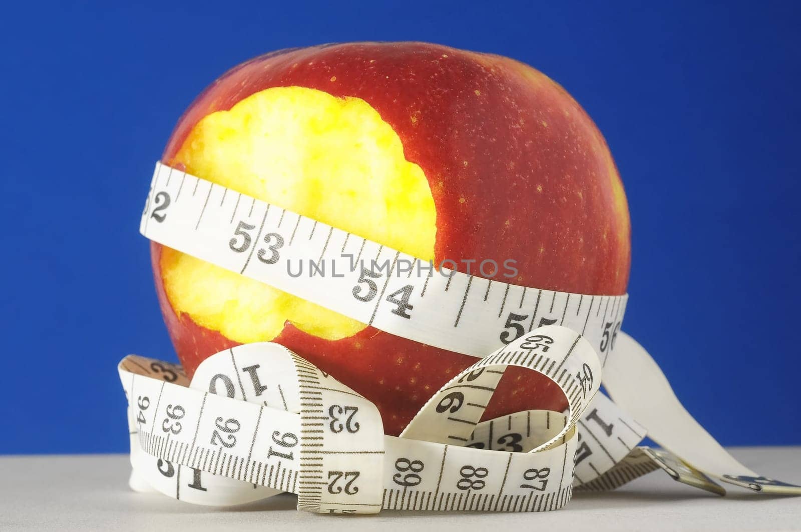 Diet Apple and Meter on a Colored Background