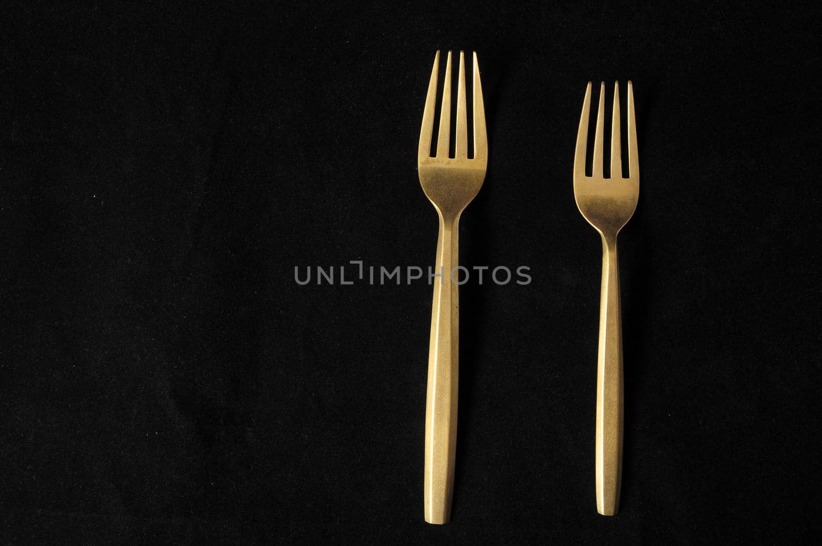 Ancient Vintage Silver Flatware on a Black Background