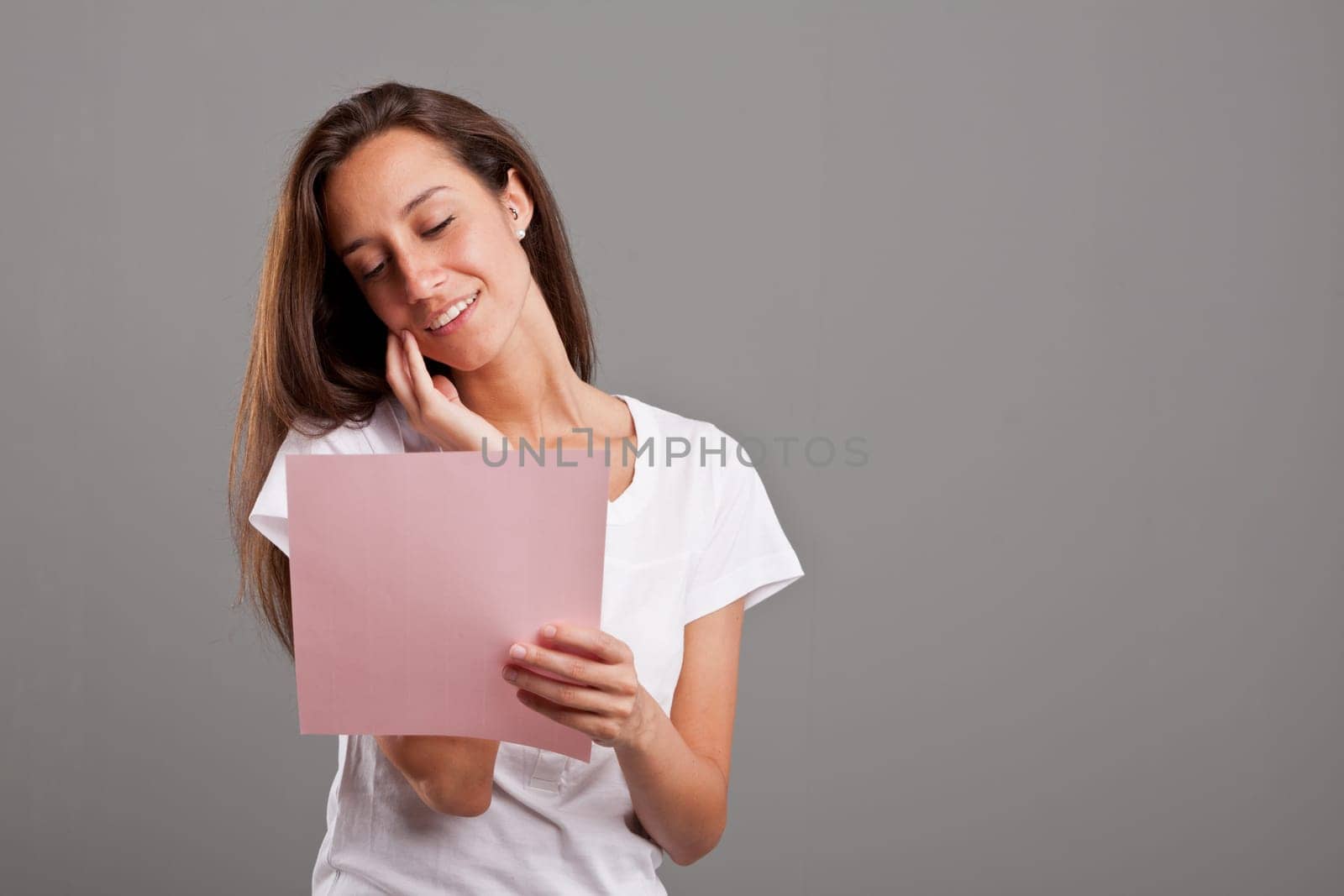 a young woman reading a love letter