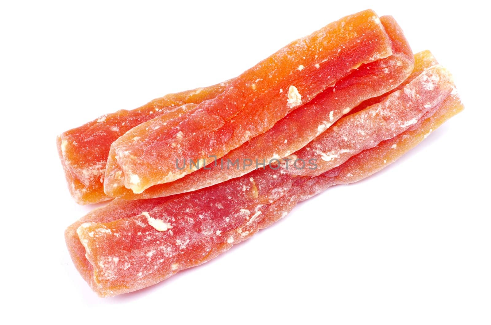 orange dried papaya slices over white background
