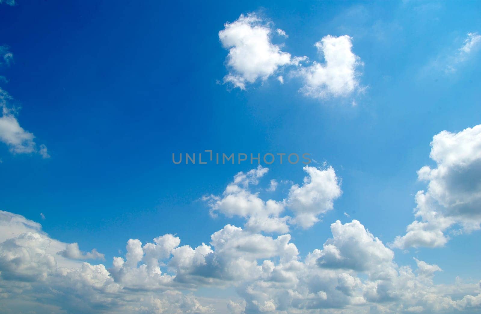 blue sky background with tiny clouds