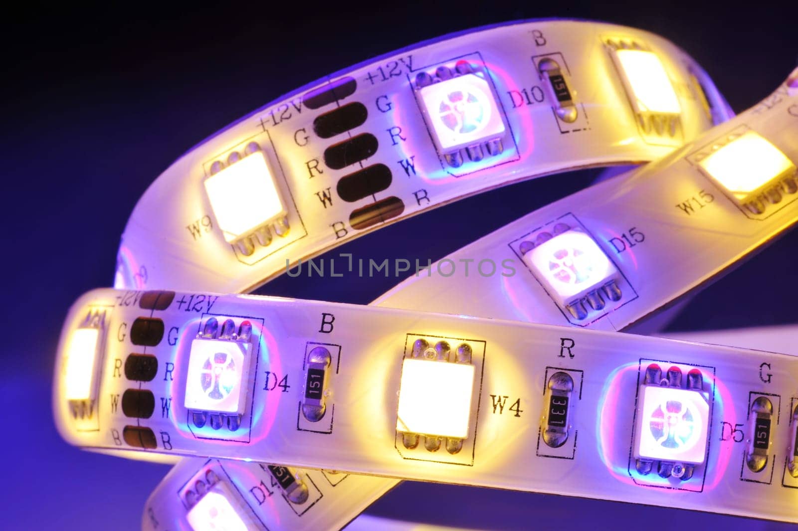 Macrodetail of an RGBW LED strip in colored light