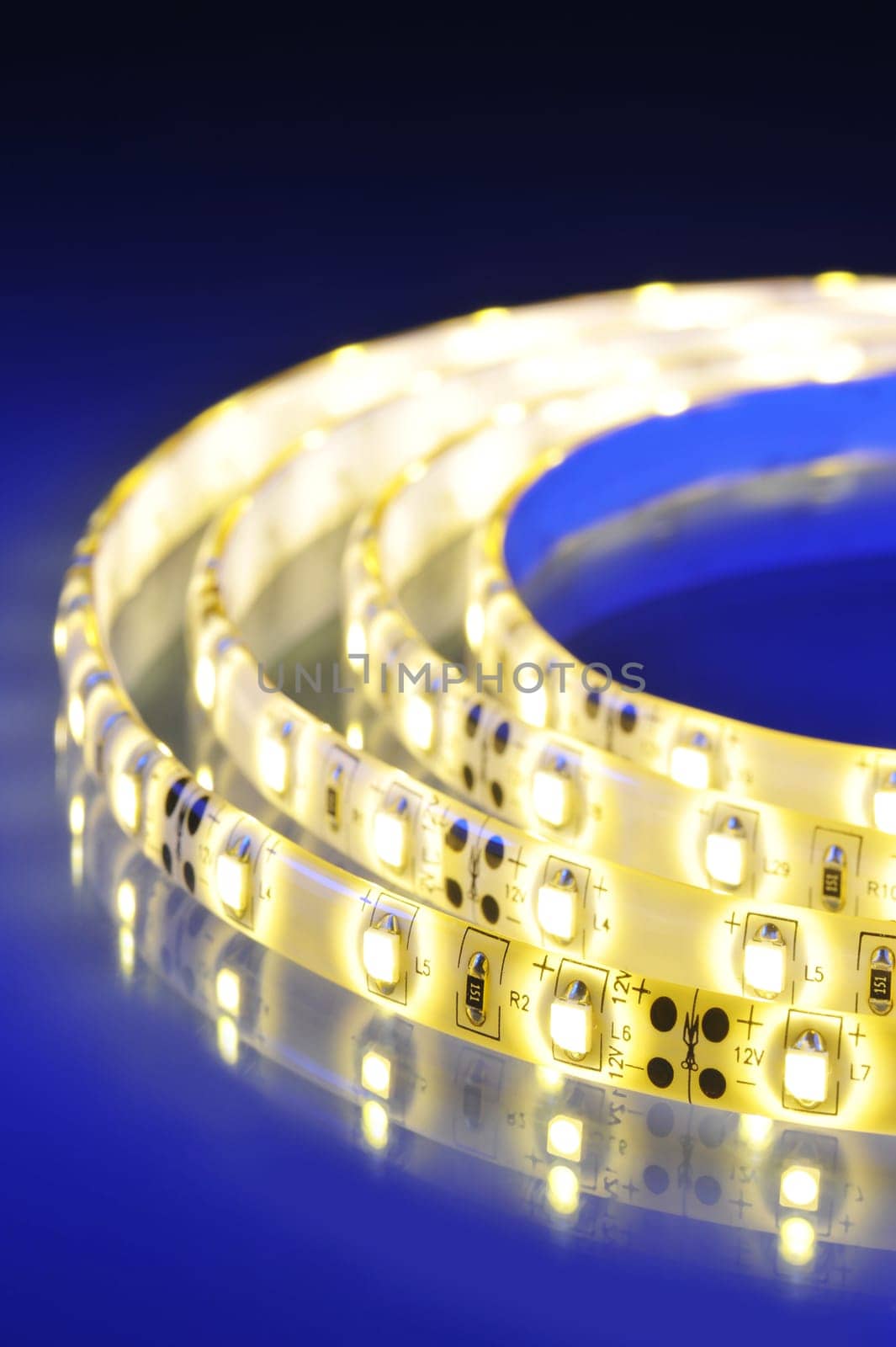 Macrodetail of a warm white LED strip in colored light