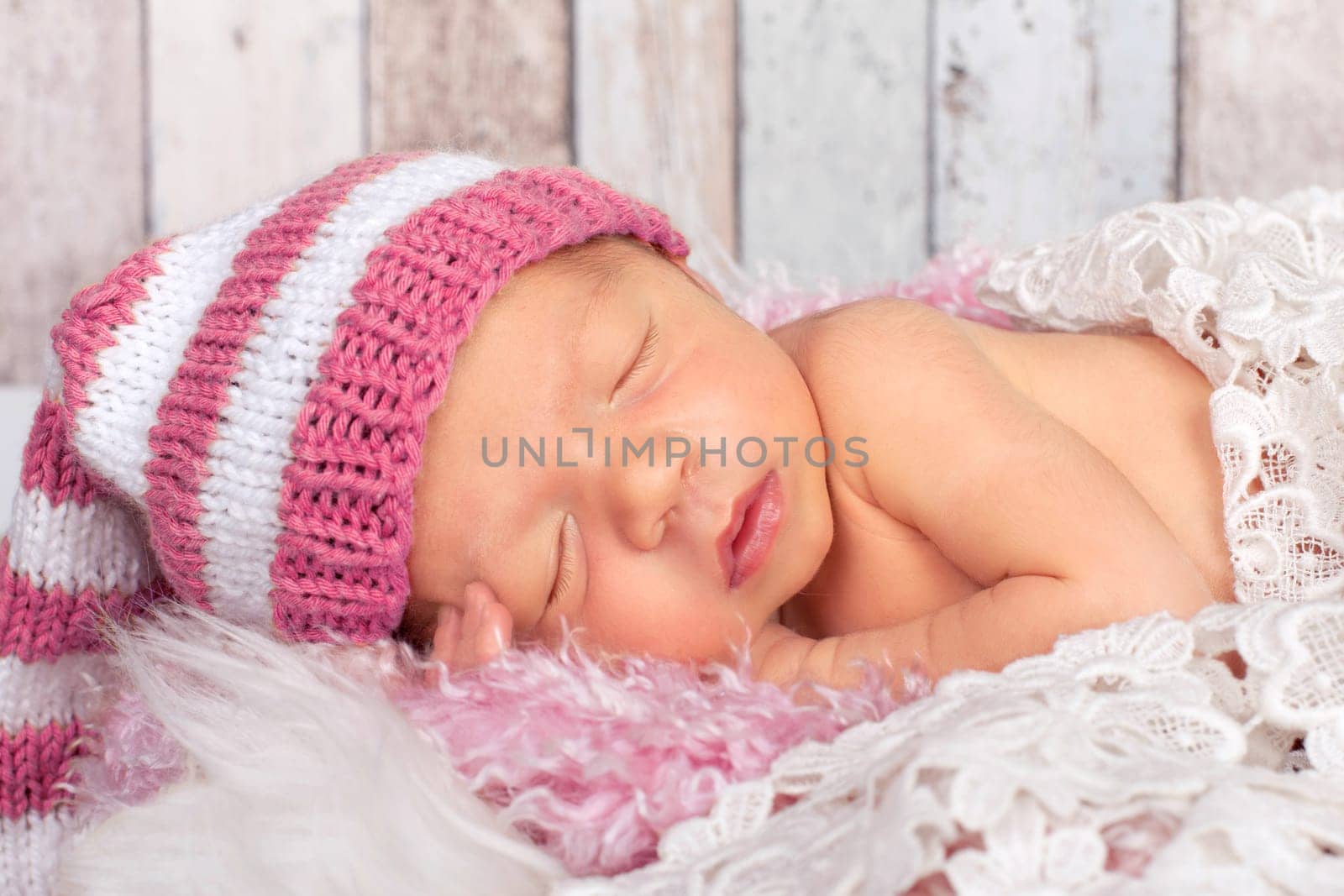 little baby with pink beanie