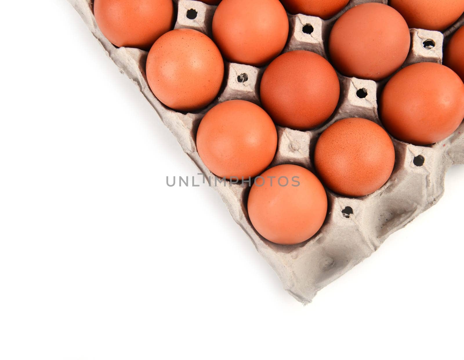 eggs in paper tray on white background