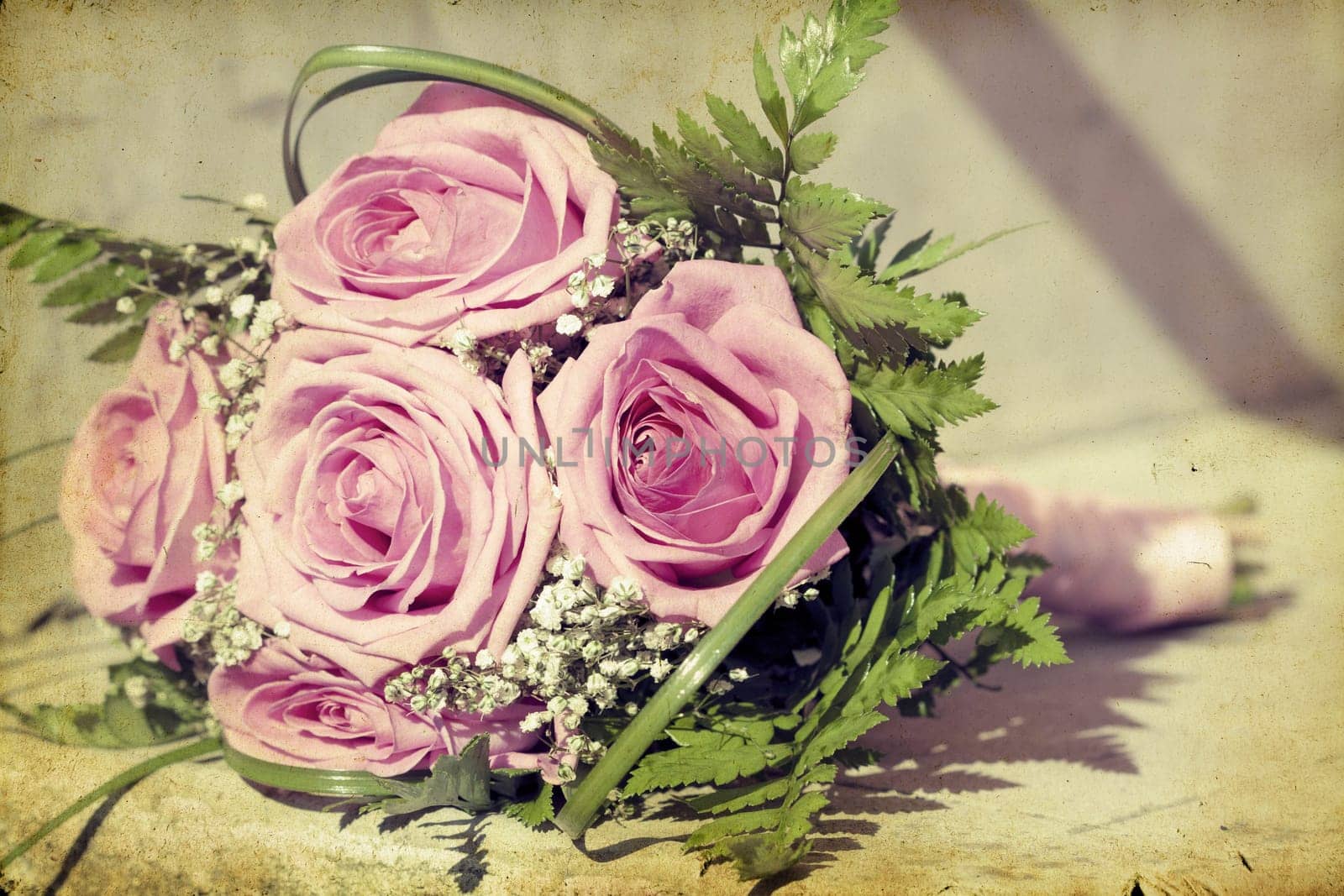 Vintage photo of wedding bouquet of pink roses