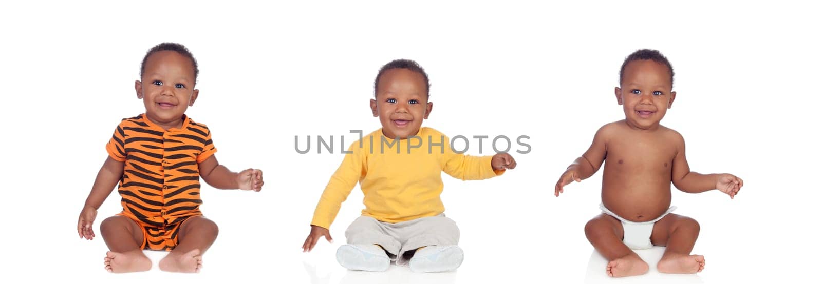 Three equal african babies with differents clothes isolated on white background