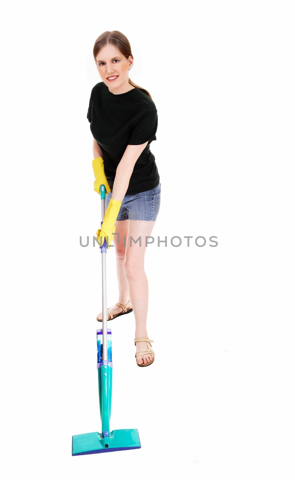 A young woman in shorts and yellow rubber cloves cleaning.the floor, smiling, isolated for white background..