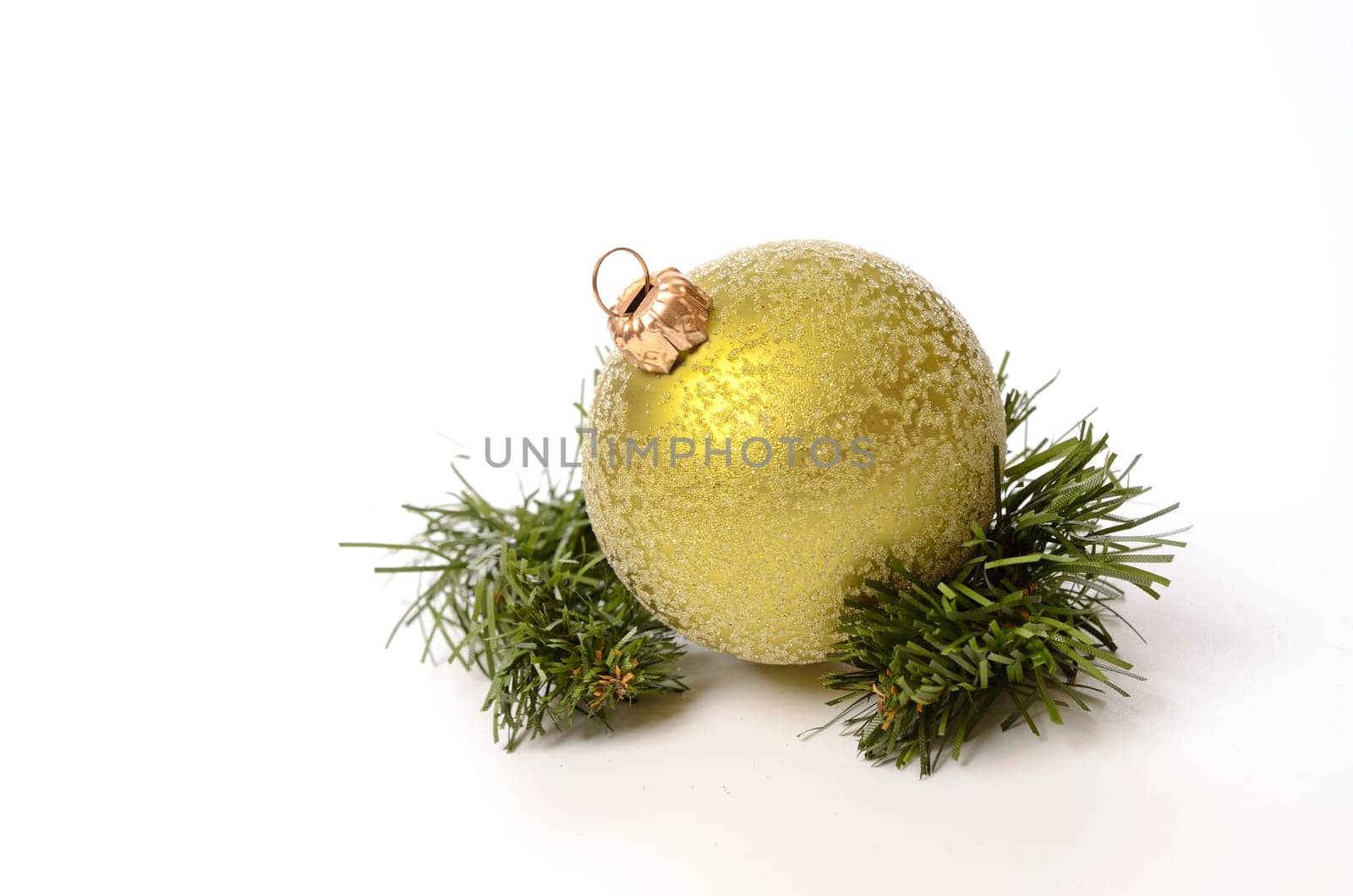 Green Christmas bauble with a twig