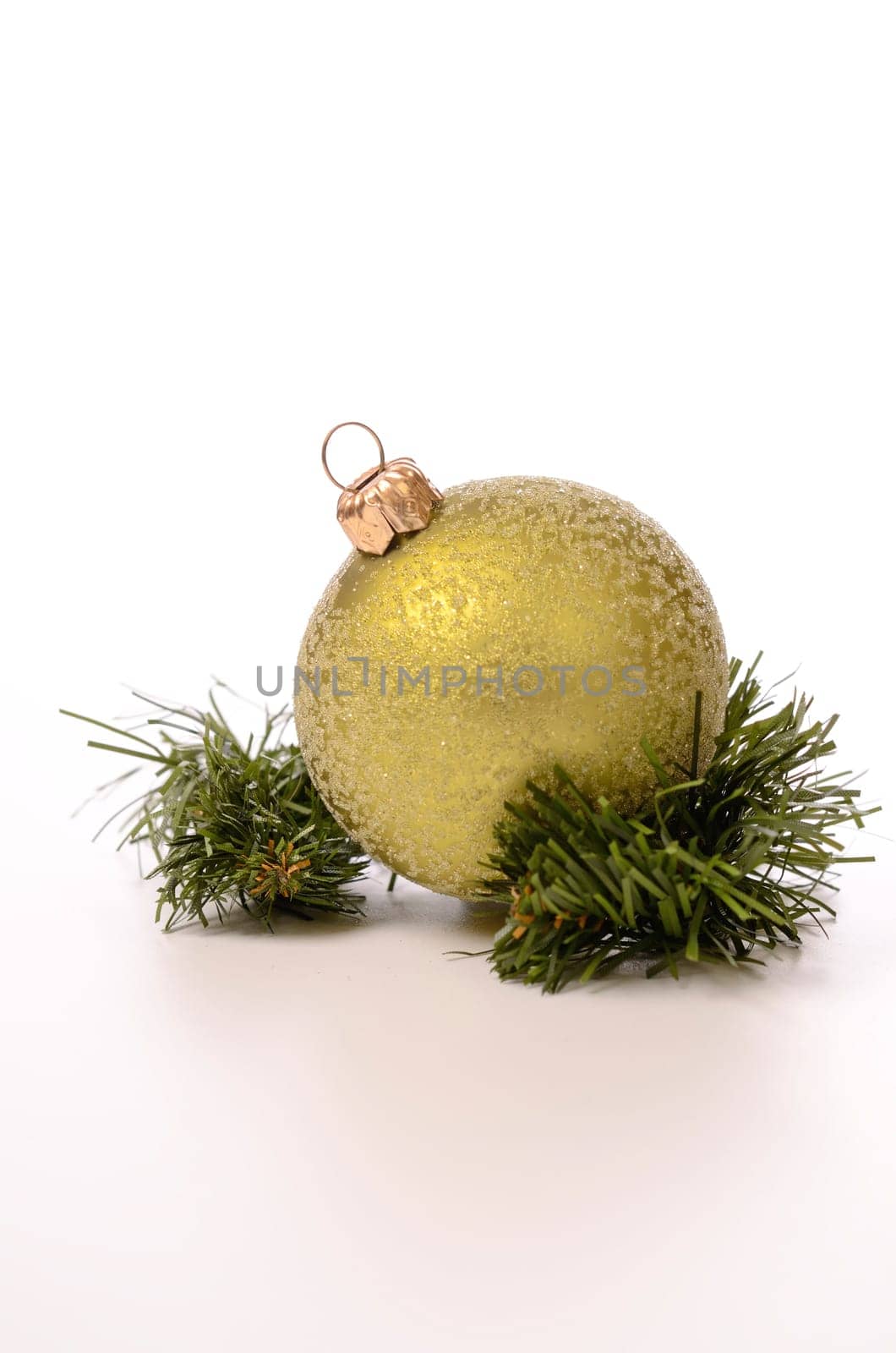 Green Christmas bauble with a twig