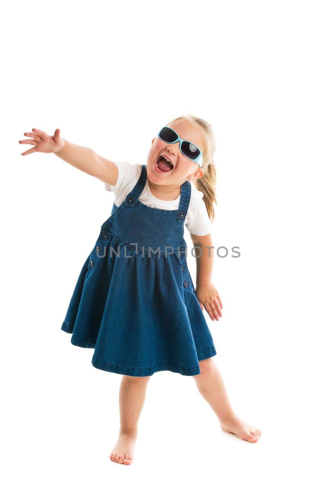 dancing little girl. studio shot