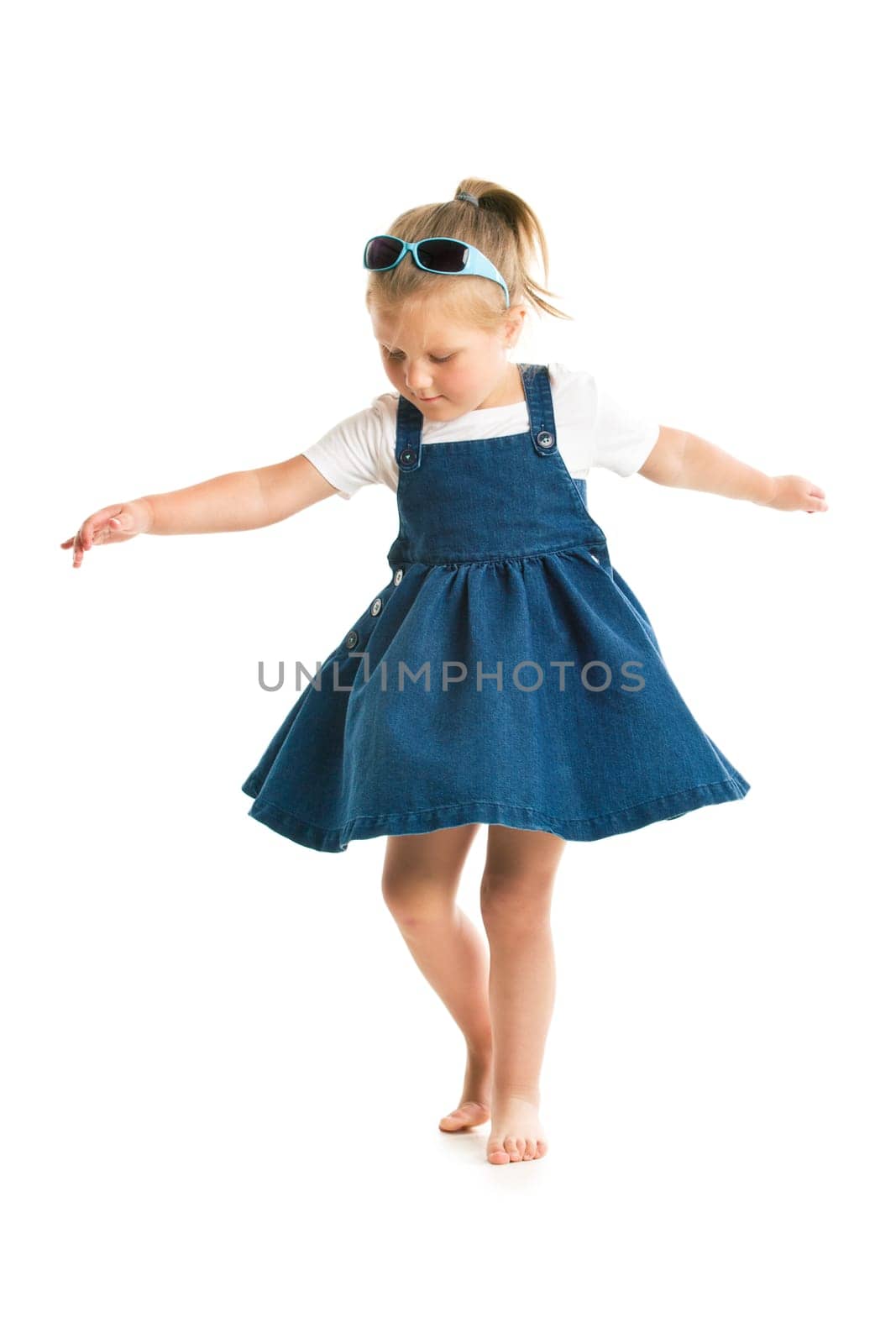 dancing little girl. studio shot