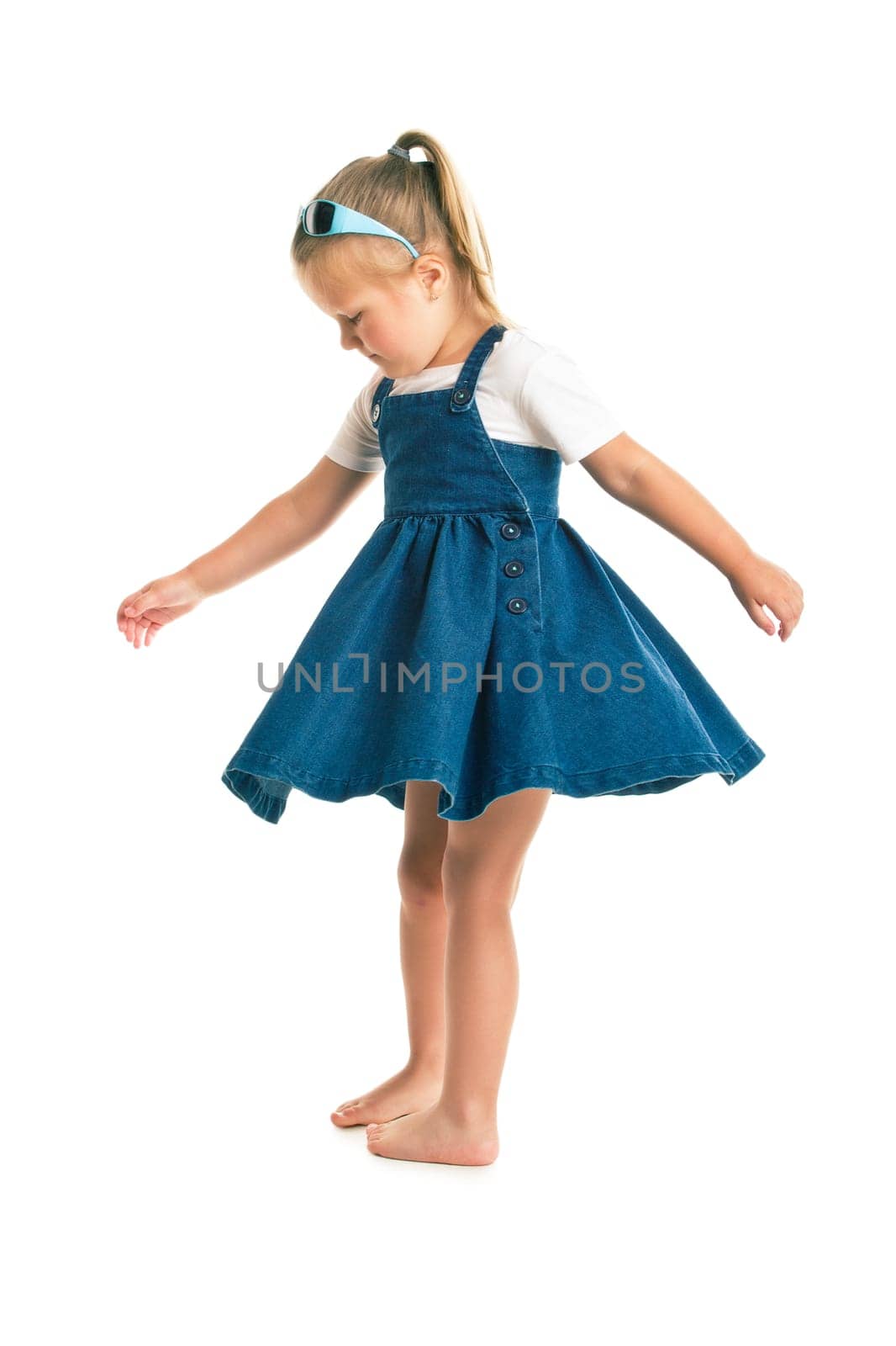 dancing little girl. studio shot