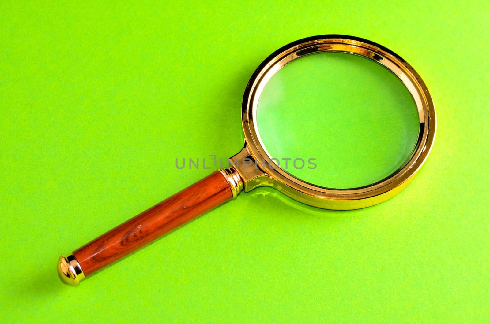 Vintage Magnify Glass Loupe on a Colored Background
