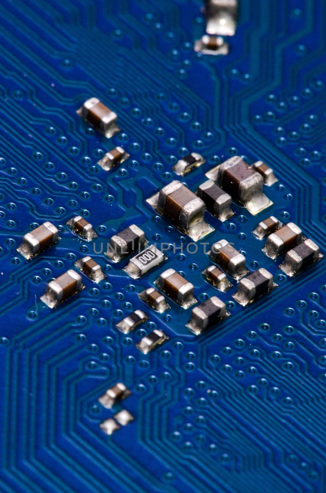 Macro Photo Of Electronic Circuit. Pcb On The Lighting.