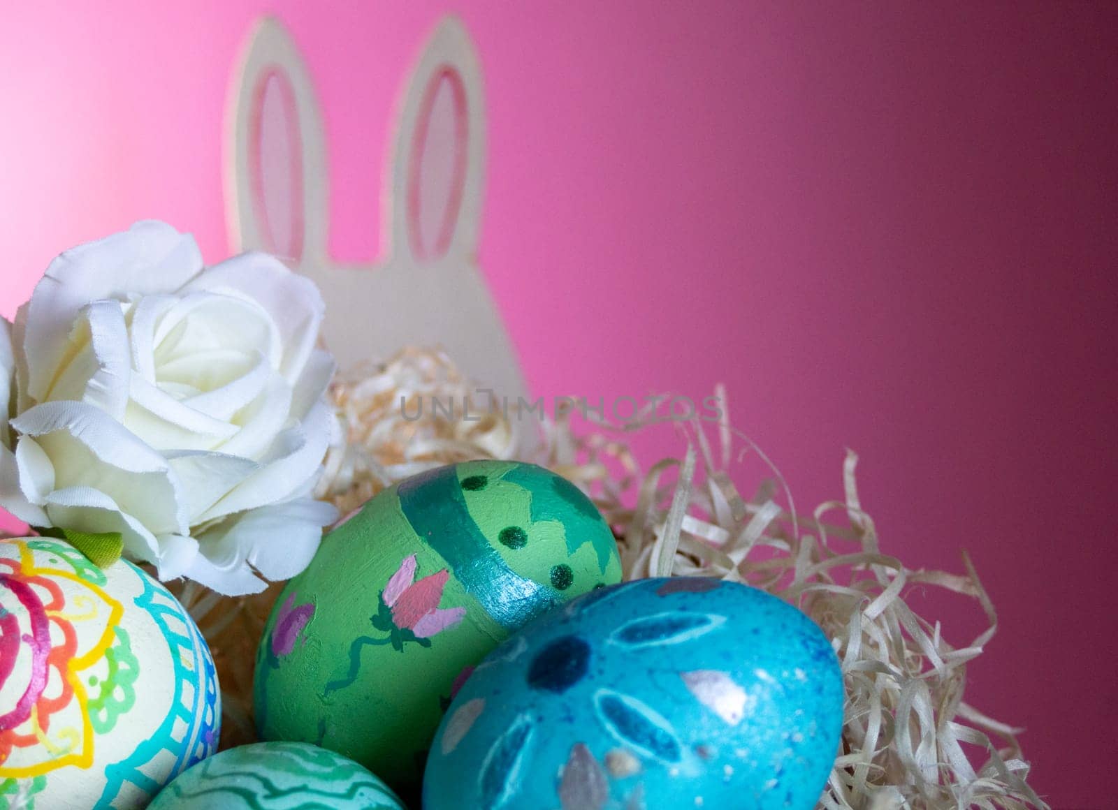 Rabbit and colorful Easter eggs in pastel background to celebrate Easter. Space for copying. Wallpaper for Easter announcements and cards.Horizontal real picture