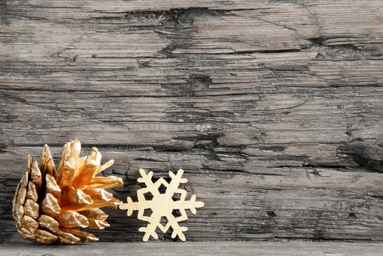 Golden Christmas Decoration on a Wooden Black and White Board with Copy Space for Your Text