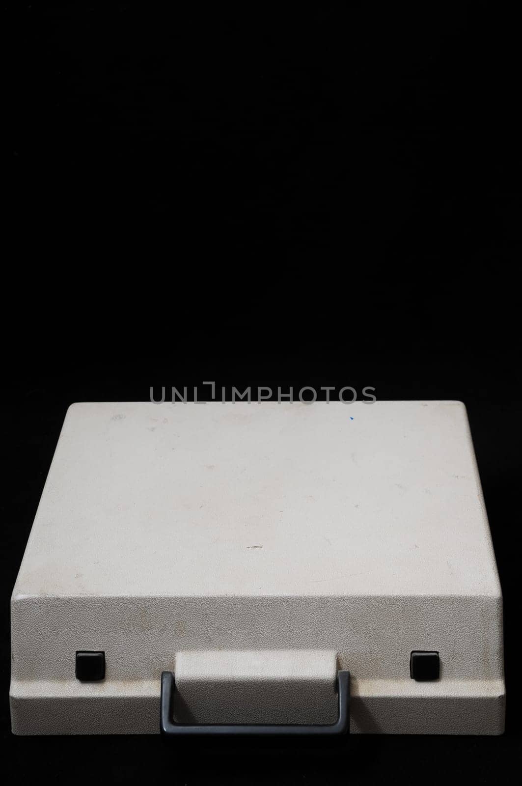 An Old Travel Vintage Typewriter Cover on a Black Background