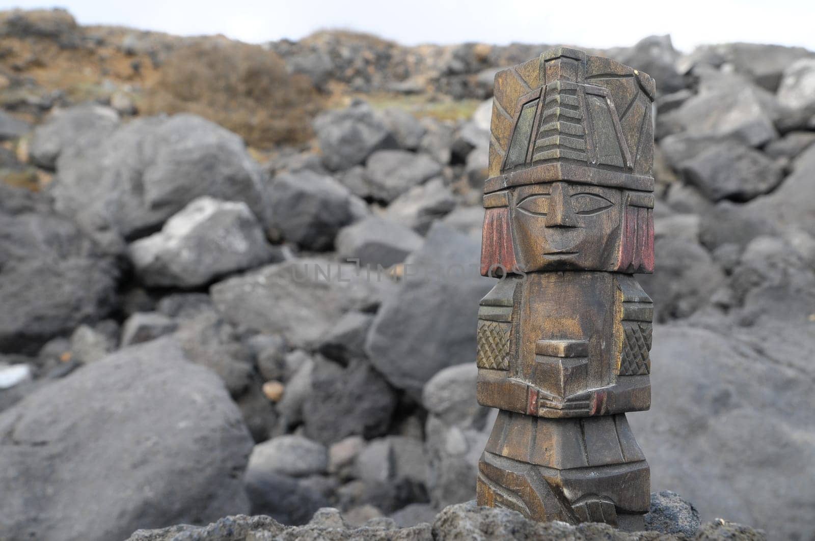 Ancient Maya Statue on the Rocks near the Ocean
