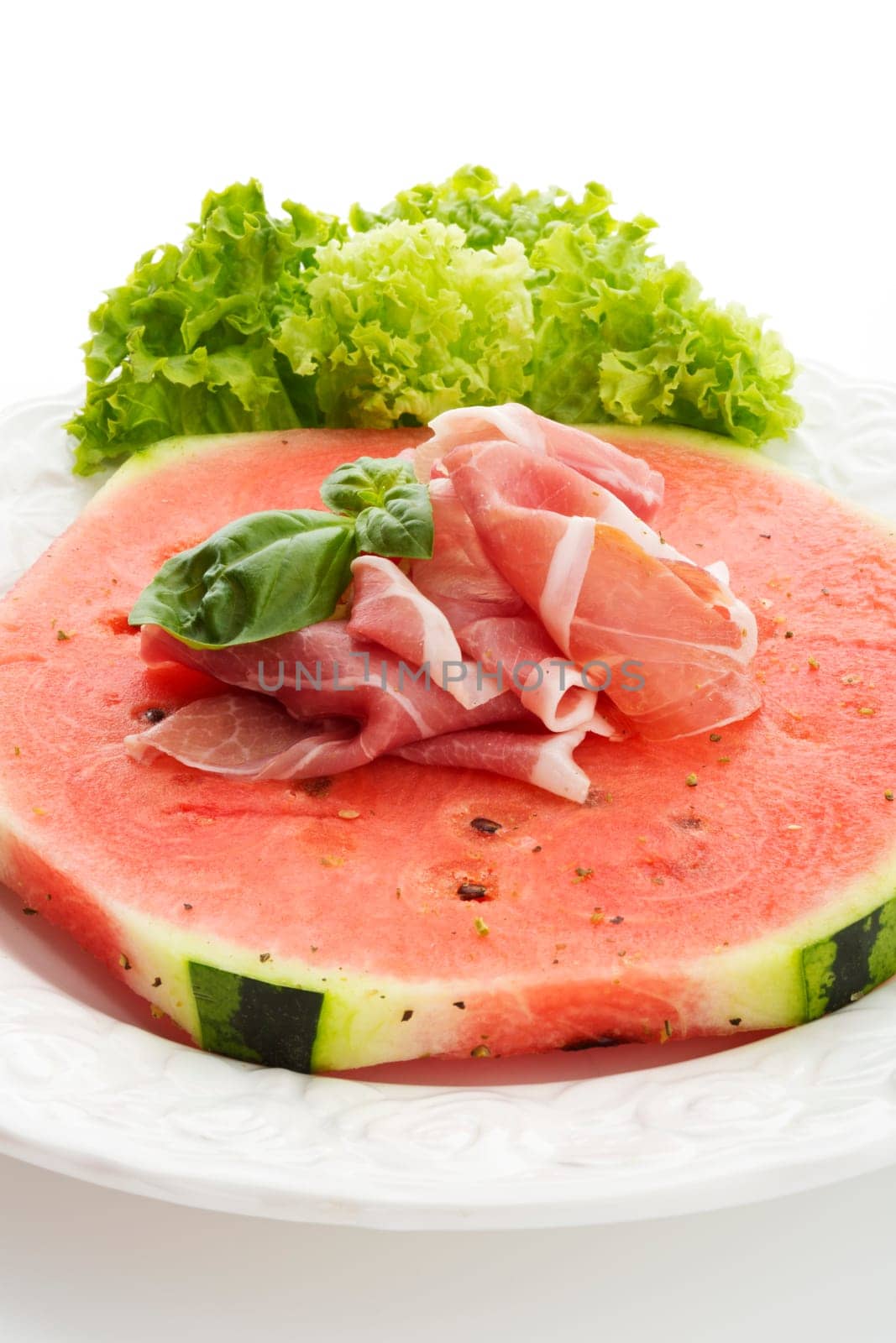 Watermelon with Parma ham and basil