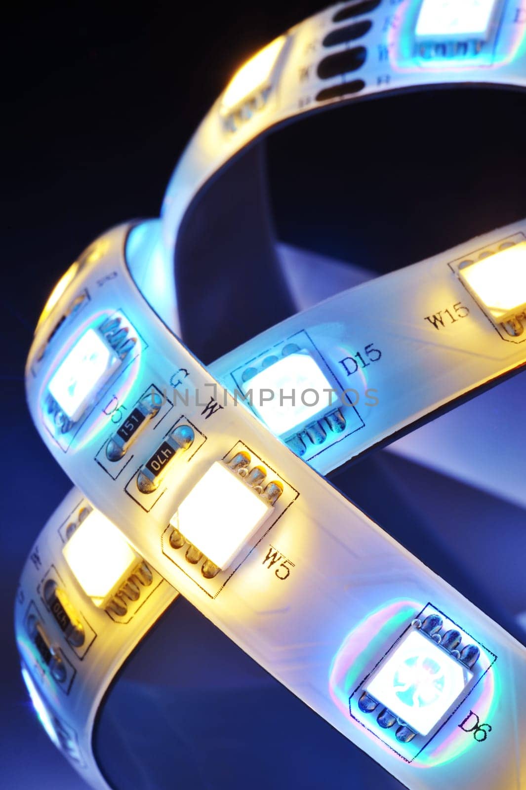 Macrodetail of an RGB LED strip combined with warm white LEDs in colored light