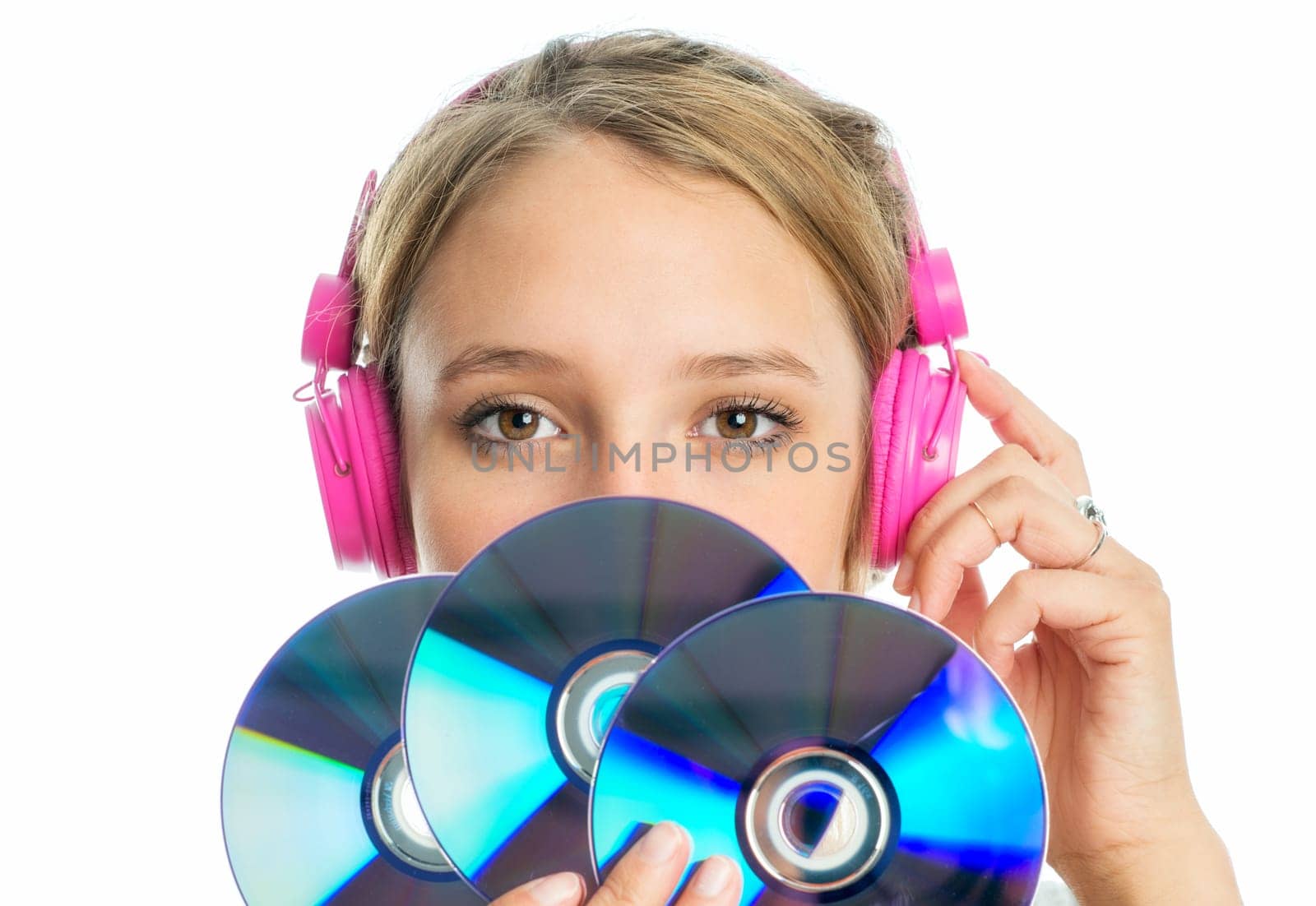 Blonde girl with headphones holds a few Cd blanks