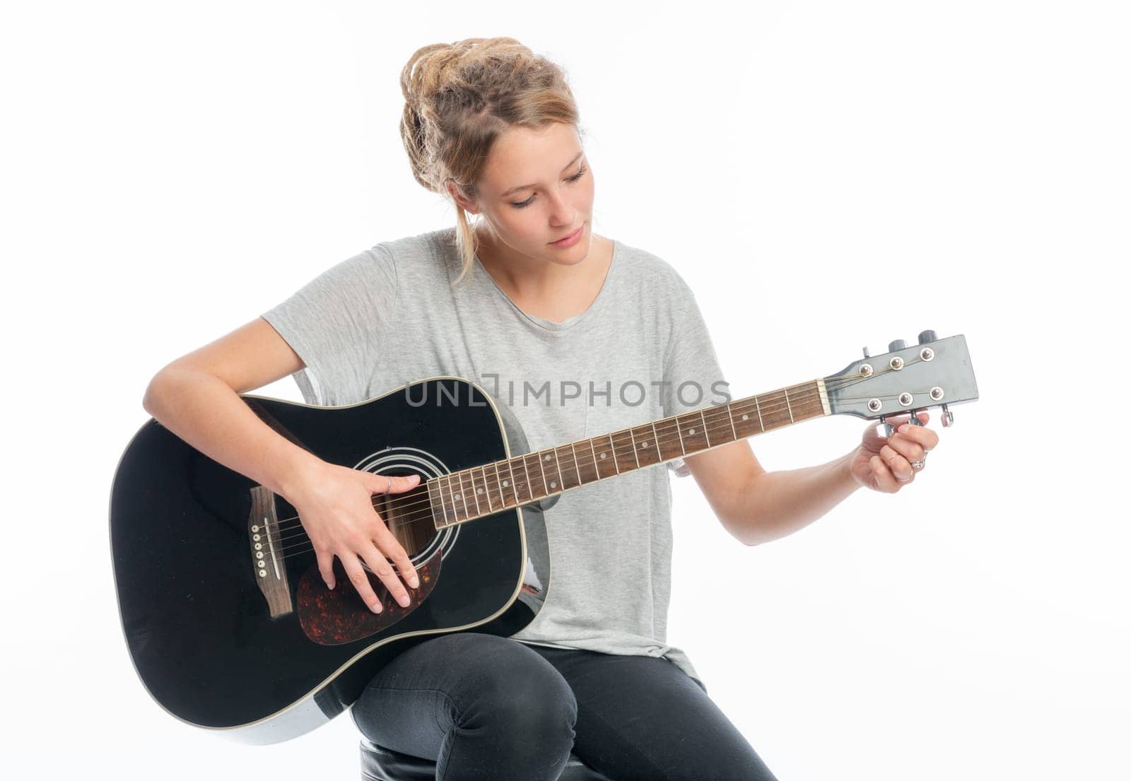 Blonde girl with a guitar