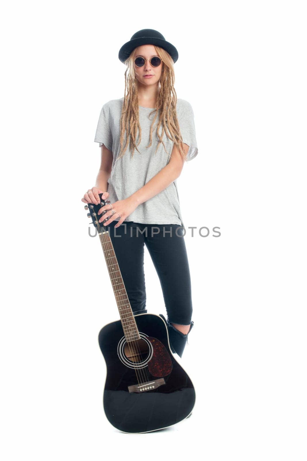 Blonde girl with hat and guitar