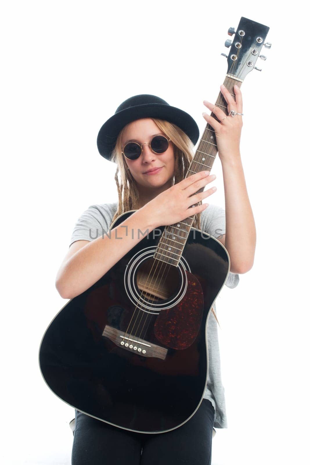 Blonde girl with hat and guitar