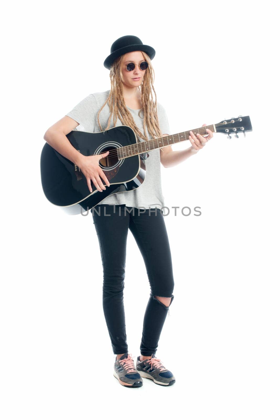 Blonde girl with hat and guitar