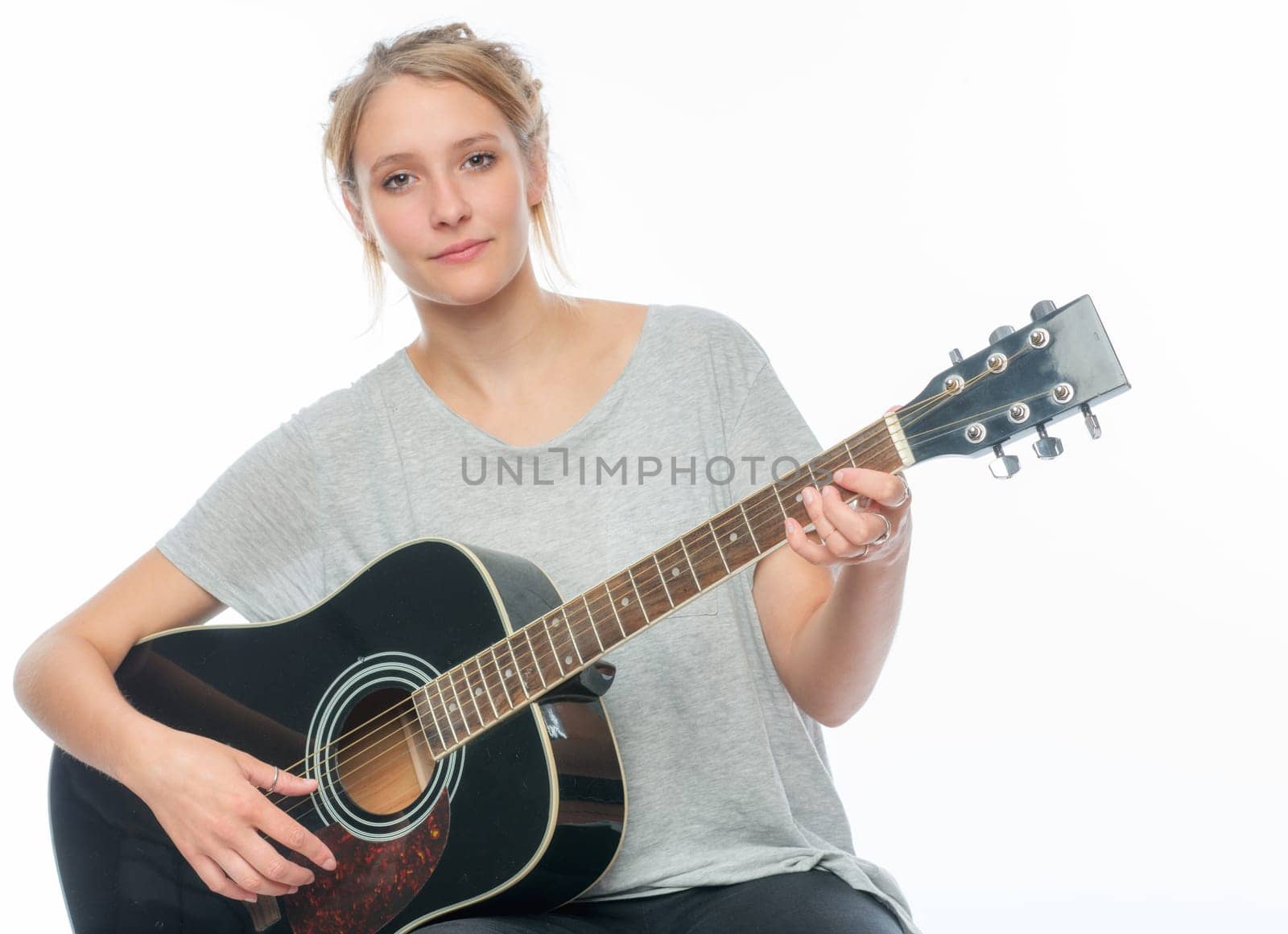 Blonde girl with a guitar