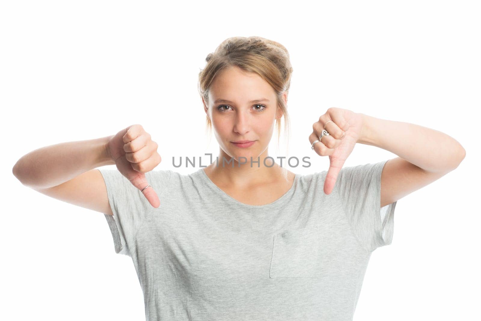 Blonde girl shows off her thumbs down