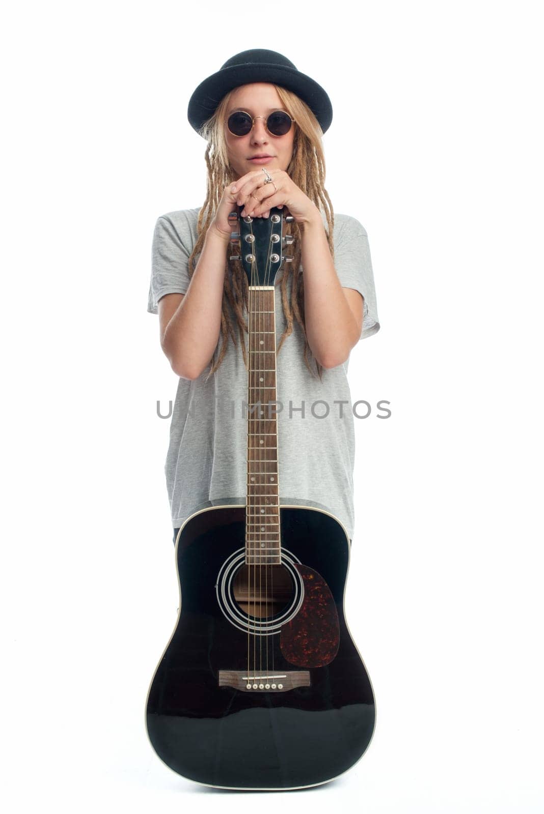Blonde girl with hat and guitar