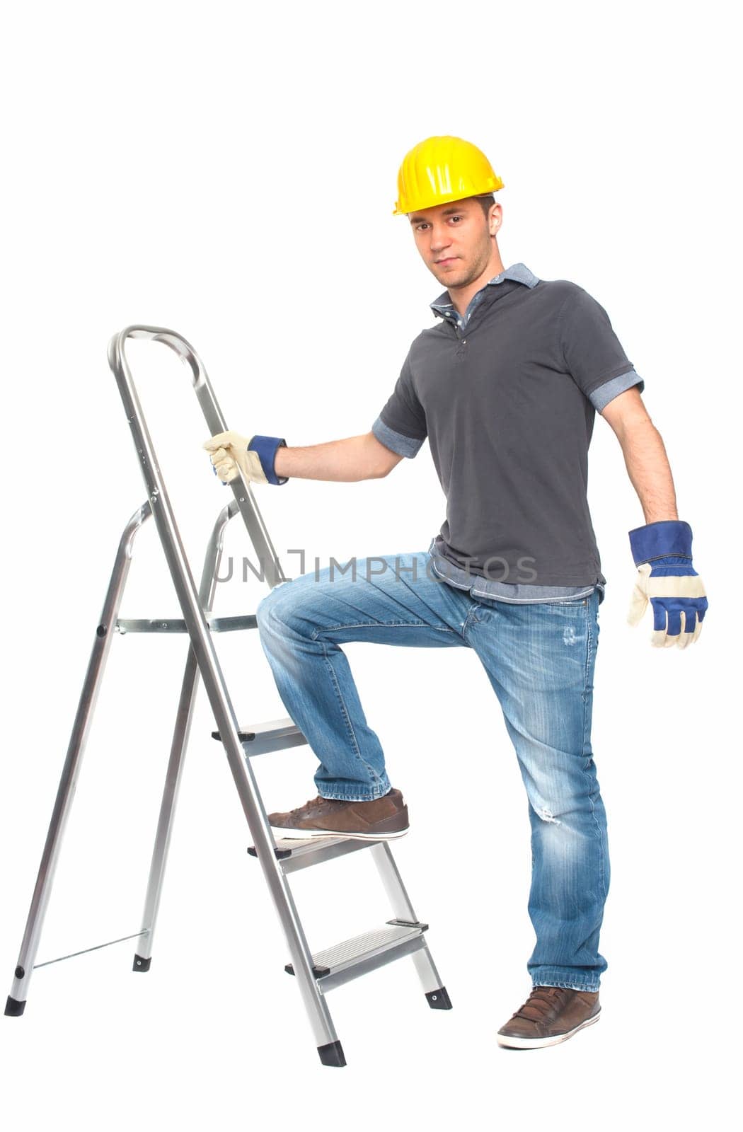 Young man with construction helmet and step ladder