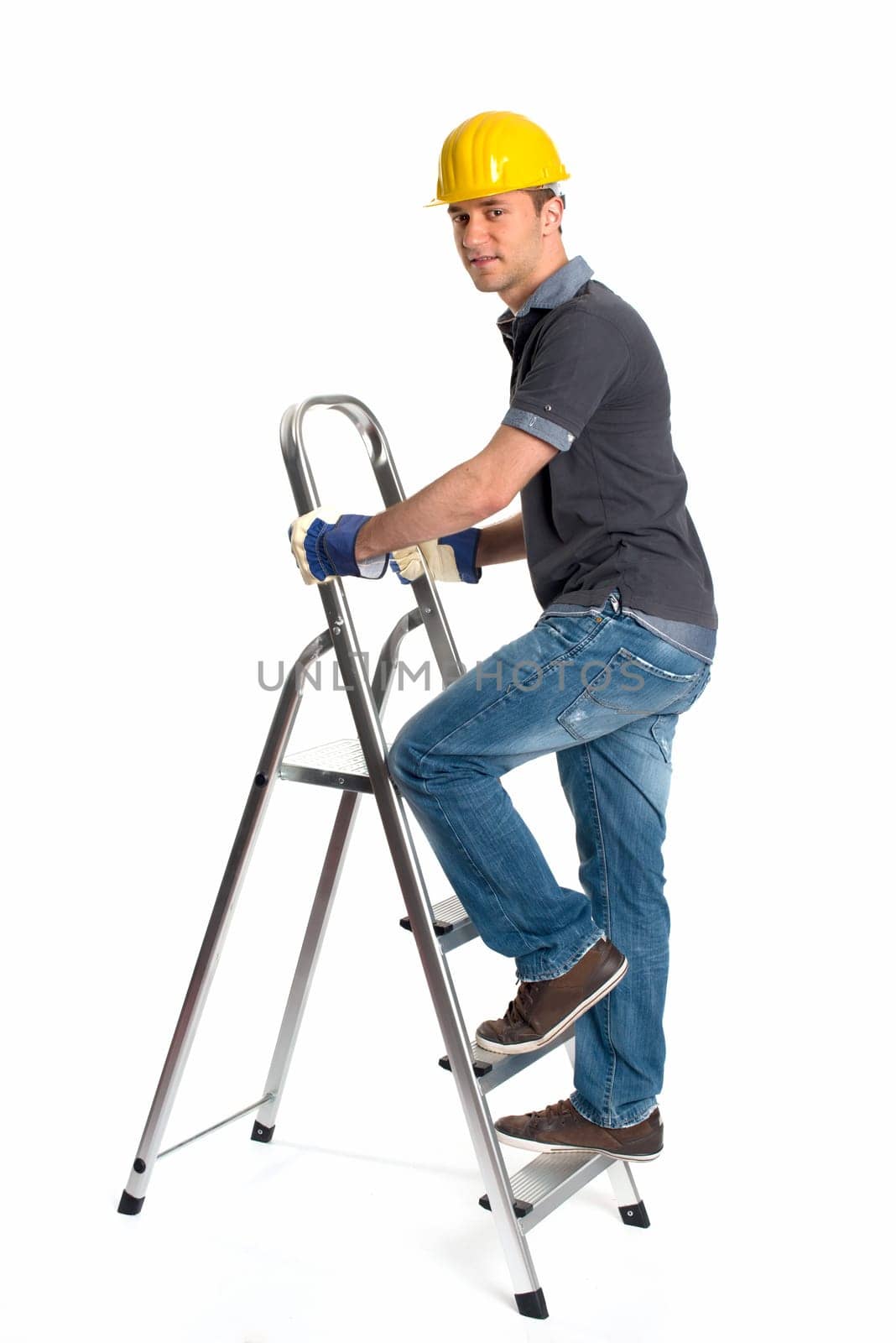 Young man with construction helmet and step ladder