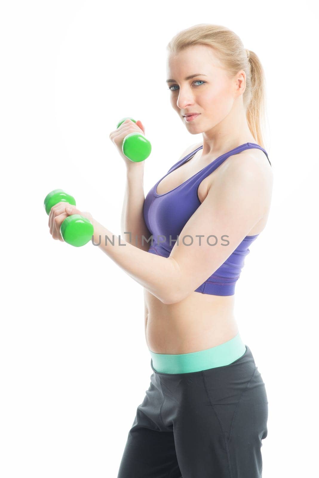 Blonde girl trained with dumbbells
